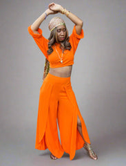 2-piece outfit set with a long cropped top and wide leg pants with high slits.