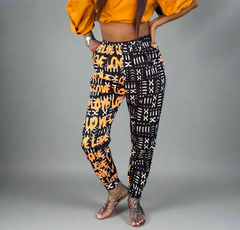 High-waist Jodhpur style pant with a black and white mud print and gold lettering on one side spellling LOVE.