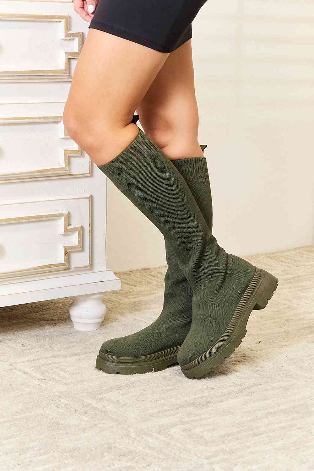 green leather knee high boots